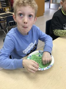 boy with bowl of slime