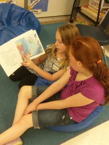 two more girls reading on bean bags