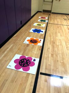 colored floor posters on gym floor