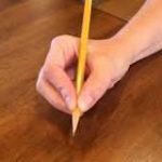 hand holding a pencil
