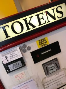 tokens taped to machine