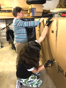two students assembling a project
