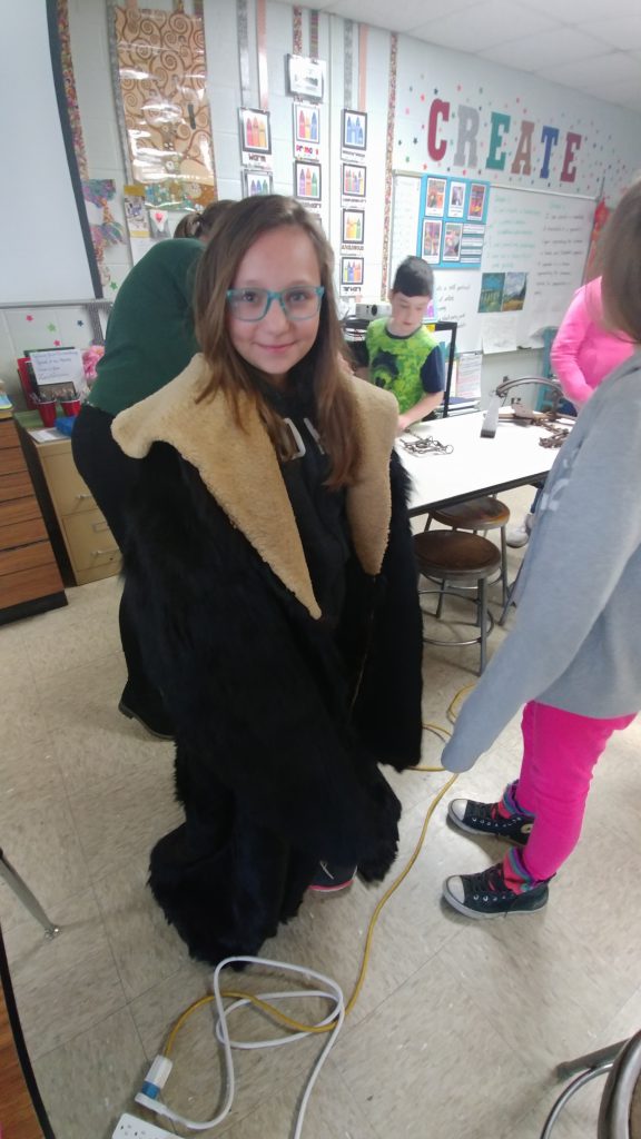 student wearing an old fur coat