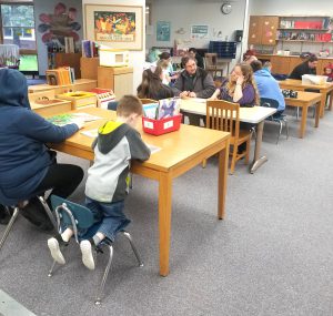 students reading at tables