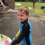 boy by a kiddie pool