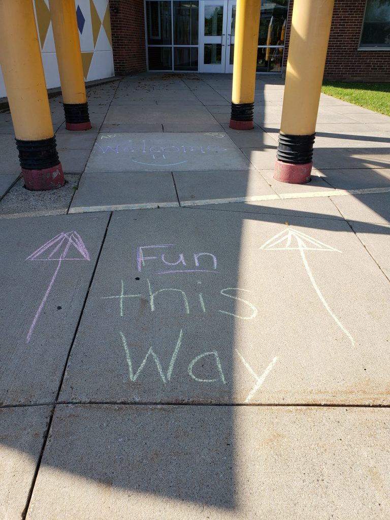 "fun this way" written on sidewalk