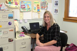 Licensed Clinical Social Worker Karyn Watson is shown sitting at a desk at her new office at Warren Street Elementary School.