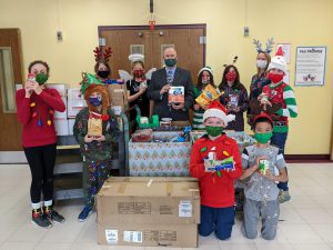 Students pose with donated items
