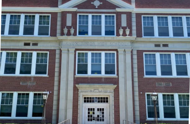 the exterior of a brick school building