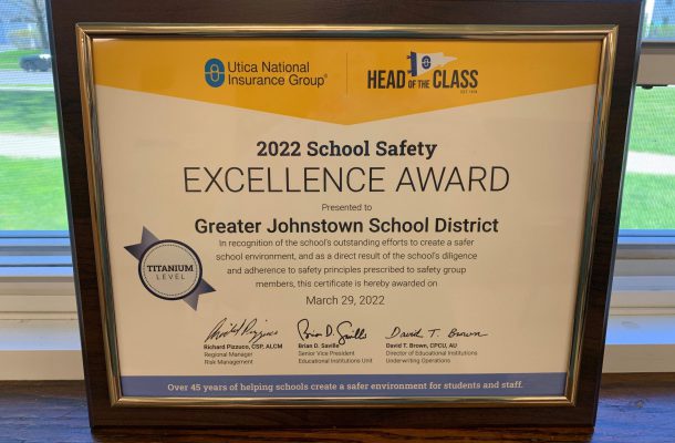 a plaque displays a certificate of Excellence award