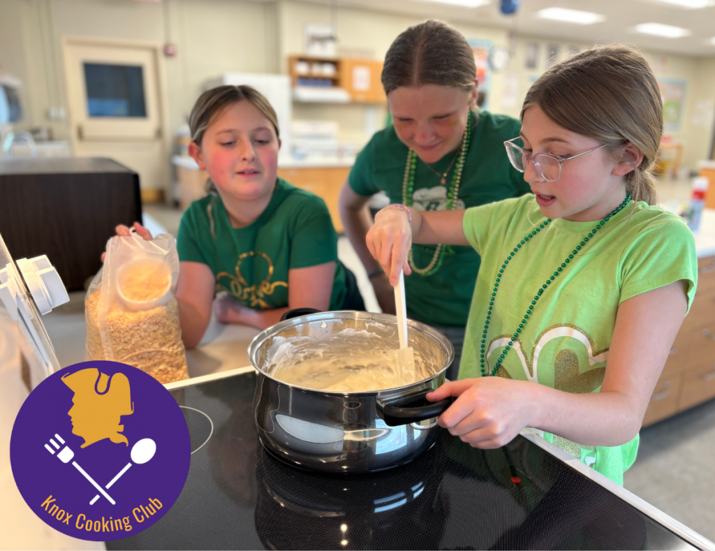 a group of three young ladies stir a pot on the stove