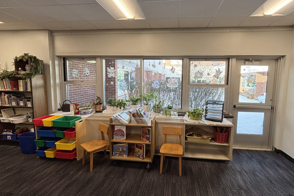 interior windows of a library show a snowy landscape outside