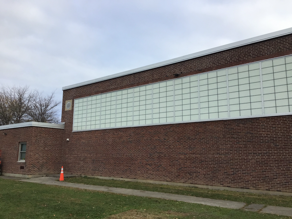 the exterior of a brick building with new windows