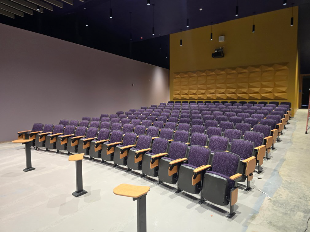 a purple and gold auditorium