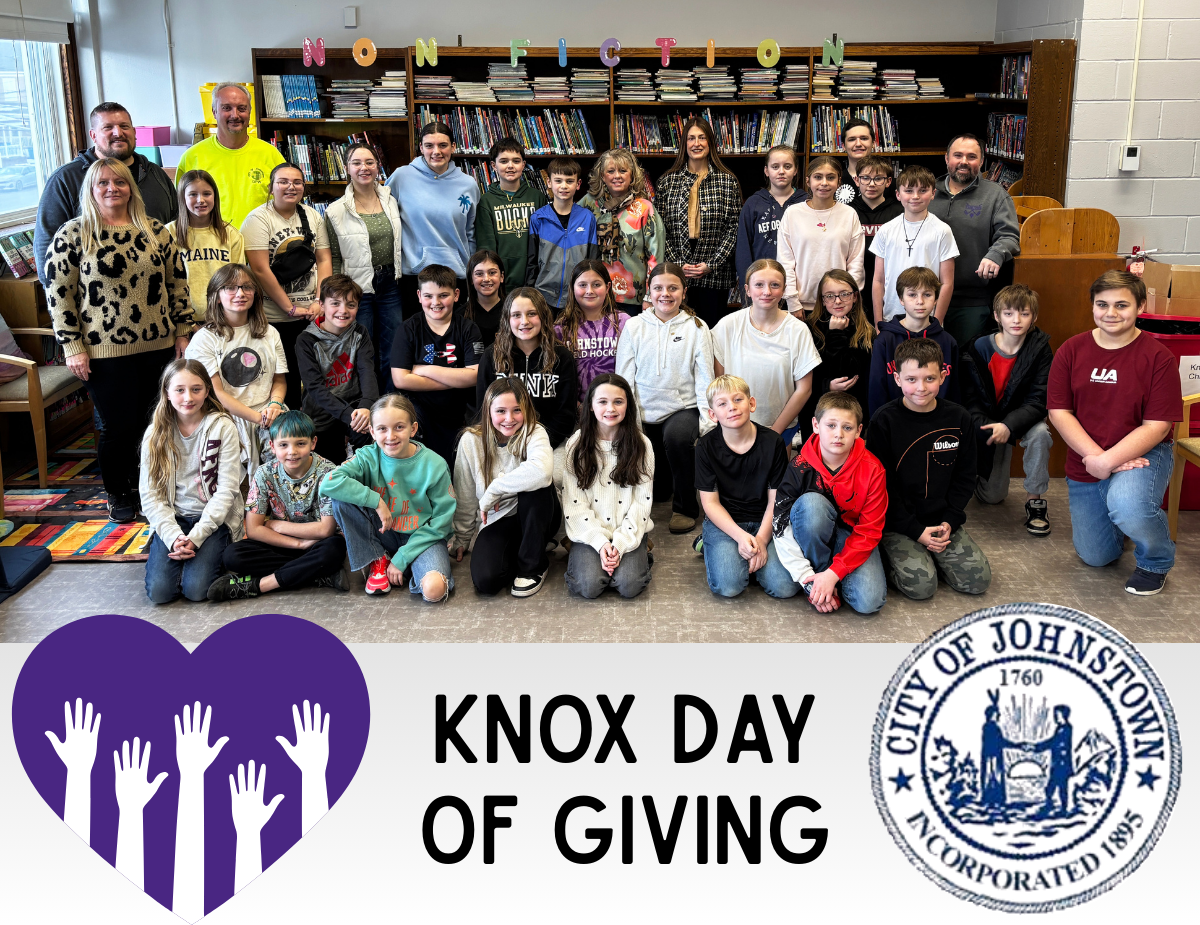 a group photo of students and adults in a library, with text that reads "Knox Day of Giving"